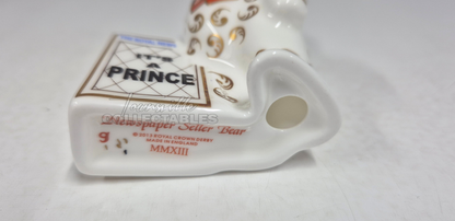 It's A Prince Newspaper Seller. Made in England from fine bone china. Hand decorated, with 22ct Gold accents. Limited Edition #350 of only 1000 pieces world wide