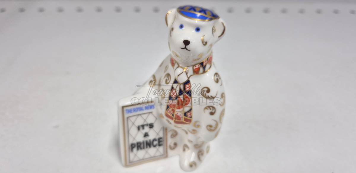 It's A Prince Newspaper Seller. Made in England from fine bone china. Hand decorated, with 22ct Gold accents. Limited Edition #350 of only 1000 pieces world wide