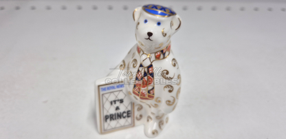 It's A Prince Newspaper Seller. Made in England from fine bone china. Hand decorated, with 22ct Gold accents. Limited Edition #350 of only 1000 pieces world wide